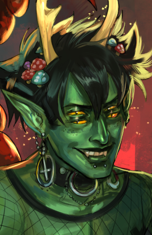 A portrait of Zox, a green-skinned demon with mushrooms in his hair and a red scorpion tail against a red tinted background.